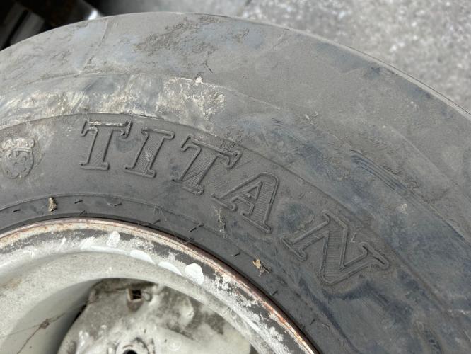 Titan 12.5L15 8 ply tire on white 6 bolt wheel